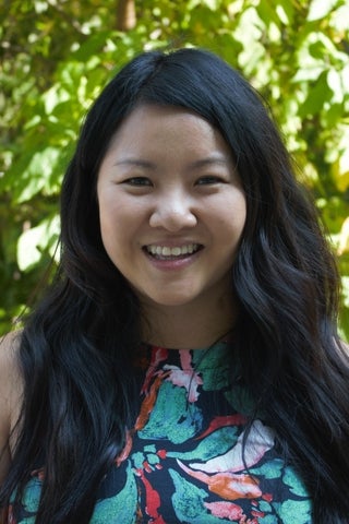 Tara is a young Asian woman with long wavy dark hair, and is wearing a tropical patterned shirt.