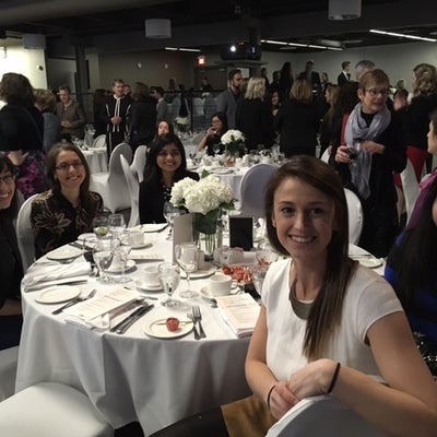 People sitting around table at International Women's Day Dinner