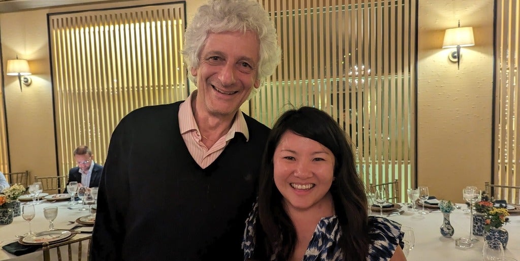 Laurent Chambaud and Tara Chen smiling together with the award