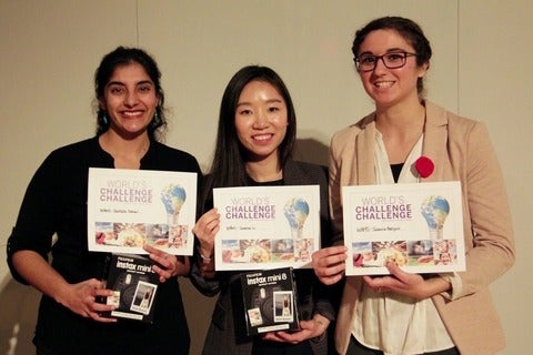 3 students smiling and holding award for world's challenge challenge