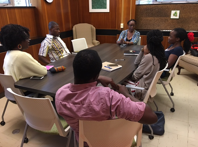 Dr. Diana Karanja chats with five of the GoHelP graduate students 