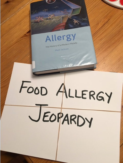 Allergy textbook and Jeopardy cards