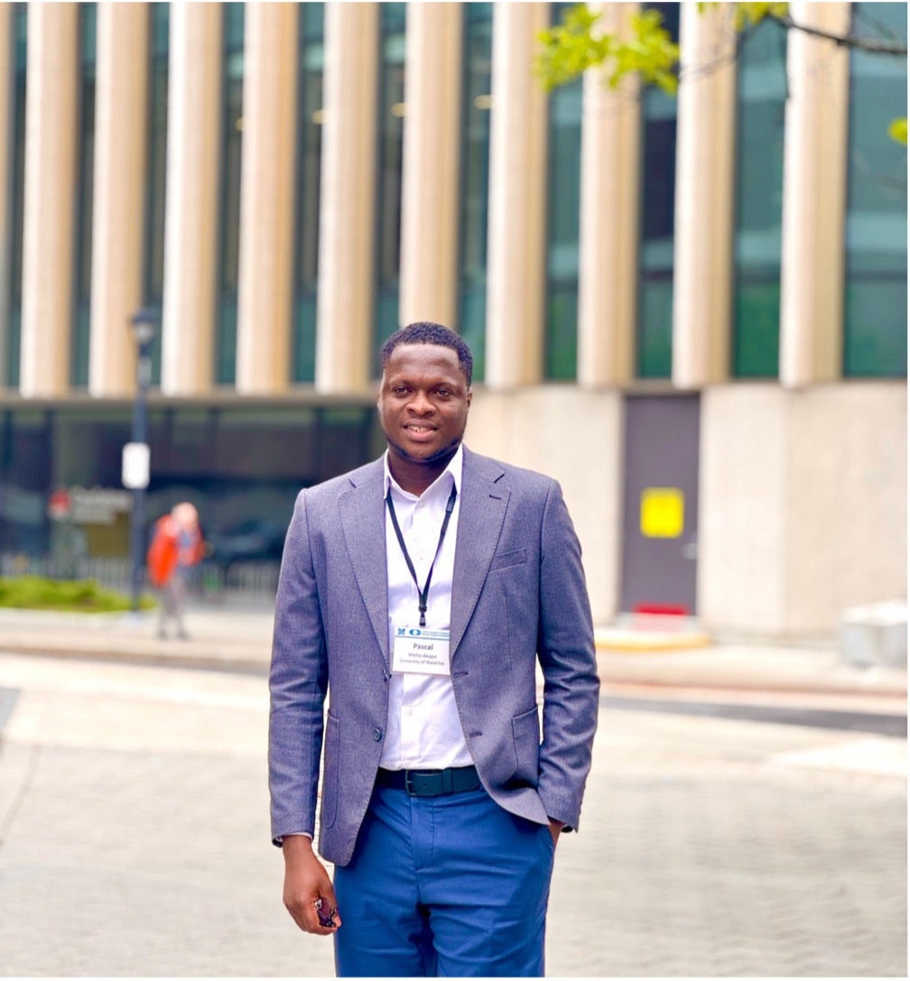 pascaal outside wearing a suit 