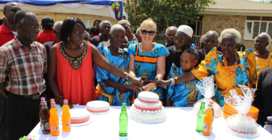 The Uganda staff and jajas cut a cake to share