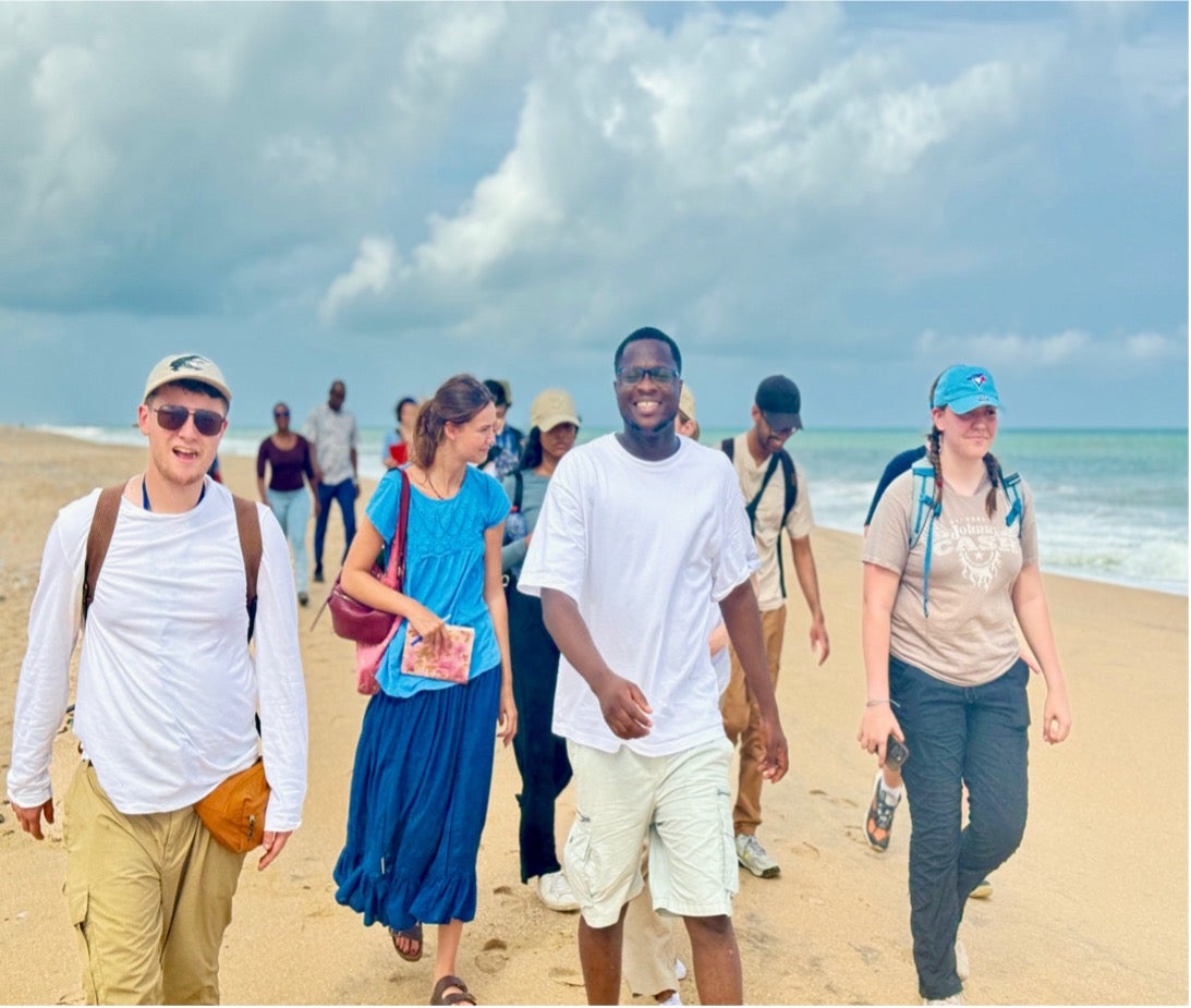 TA's and students walking on the beach
