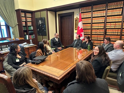 Geography students speaking with speaker Fergus in Ottawa
