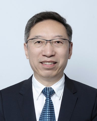 Jonathan Li in a suit and tie