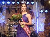 Miss Oktoberfest 2012 winner Lindsay Coulter holding bouquet and wearing sash