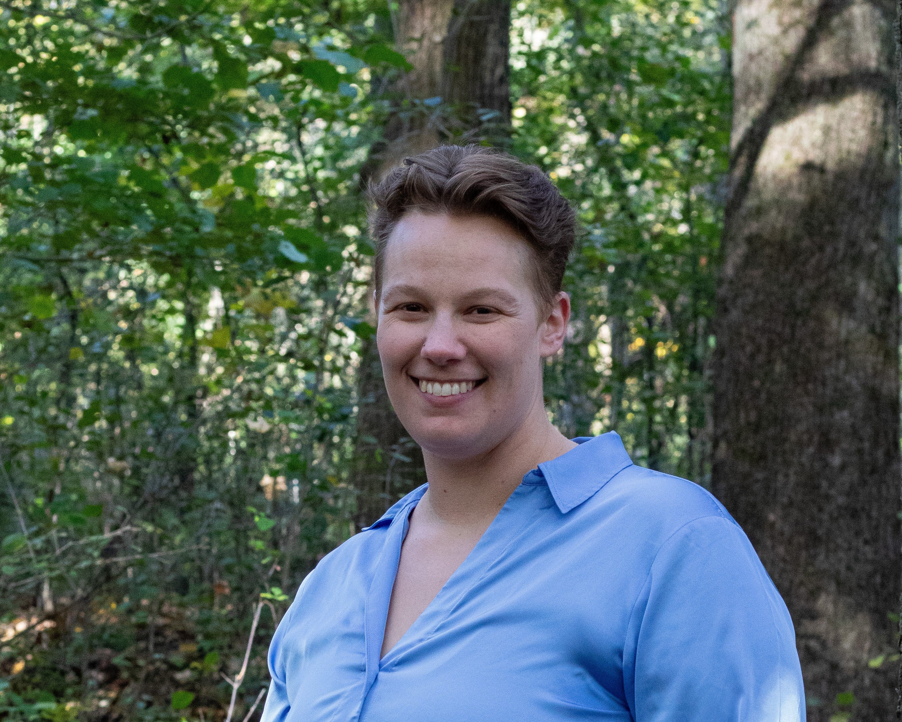 Meg Schmidt standing in a forest