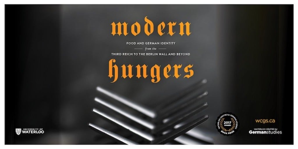 Symbolic picture of two forks forming a fence with modern hungers written above them