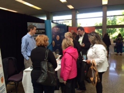 Ryan and Steve interacting with attendees at conference. 