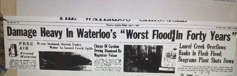 Headlines of historical Waterloo newspaper highlighting flooding