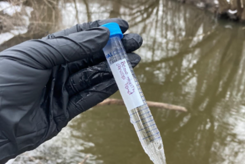 Image showing a hand holding a water sample.