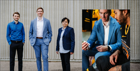 Four people wearing professional blue