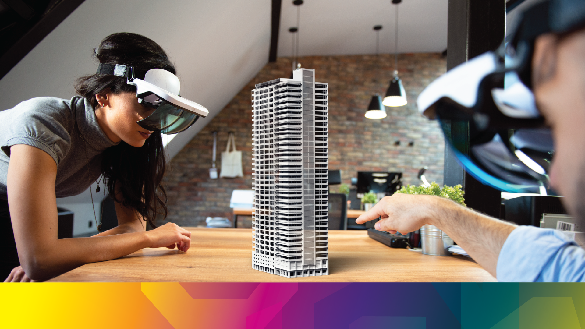 Students gathered around a model while wearing VR headsets