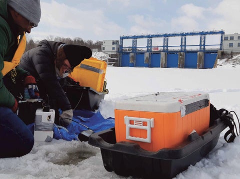 Winter sampling of a reservoir.