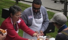 Dr. Sue Horton and GSA President Hassan Nasir serving graduate students at welcome week event.
