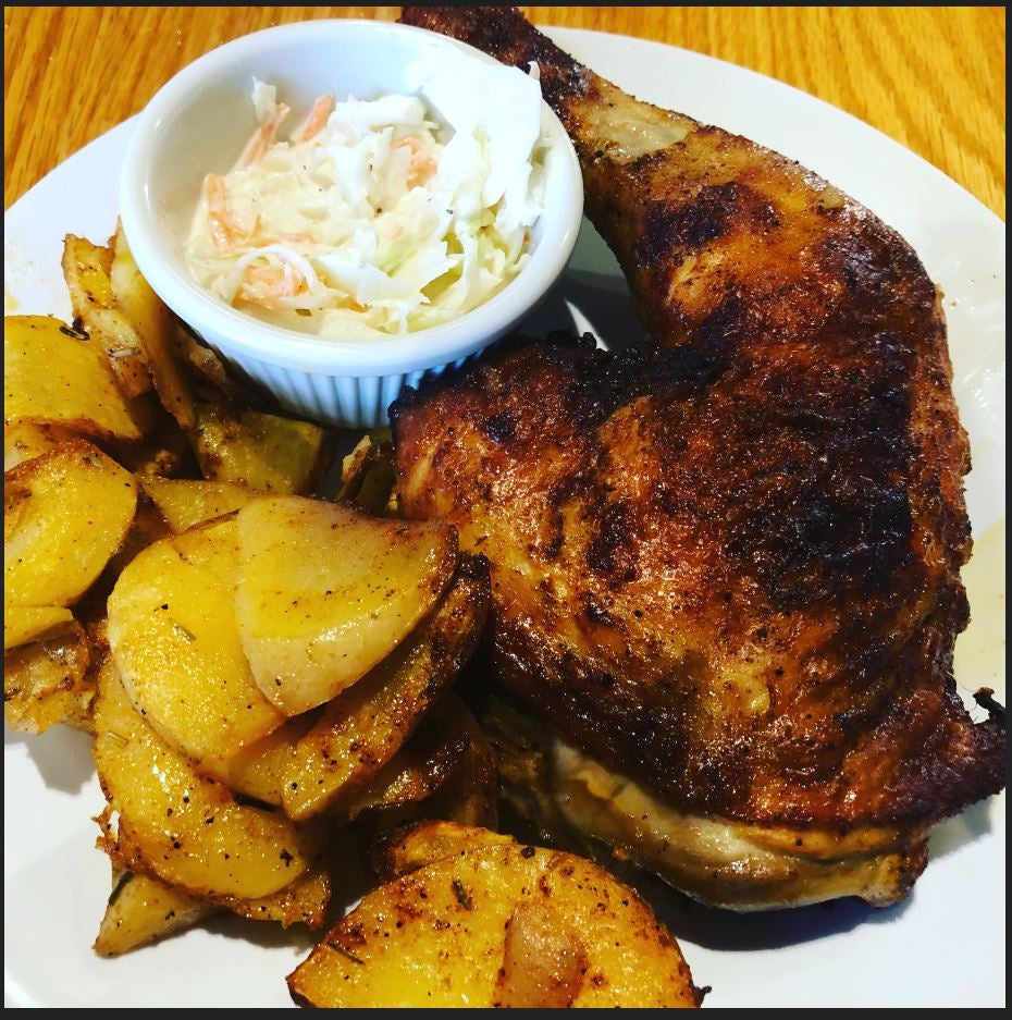 Plate with Chicken and Potato Fries and Salad.