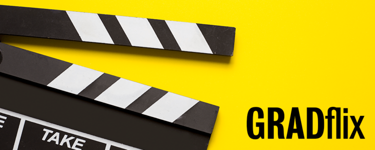 Movie prop with a yello background that says GRADflix