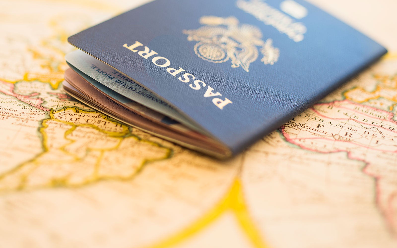 Passport on map background image.