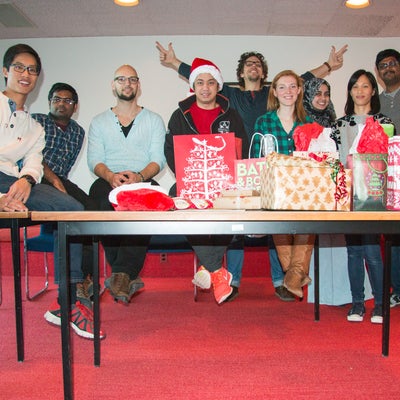 Photo of grads in secret santa gifts exchange