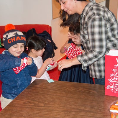 Photo of asmaa's kids opening their gifts