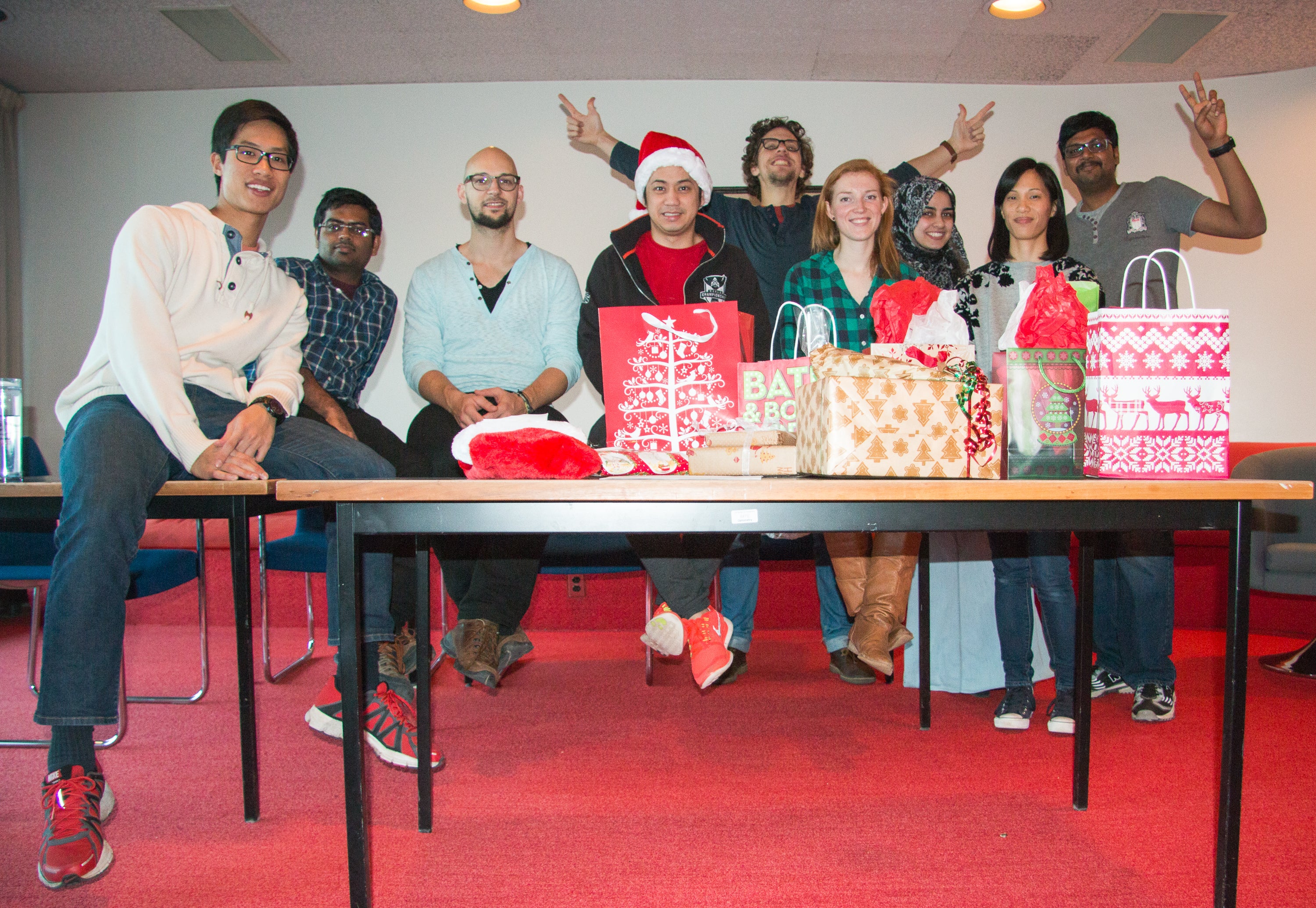 Photo of grads in secret santa gifts exchange