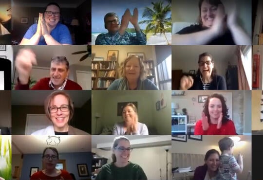 Staff serenade Lowell Ewert over a video conference call. 