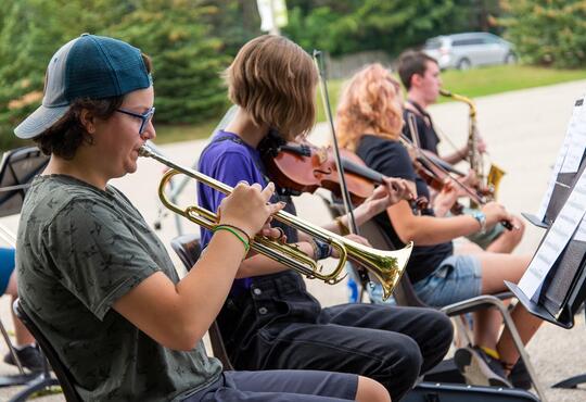Students at Music Camp playing brass instruments