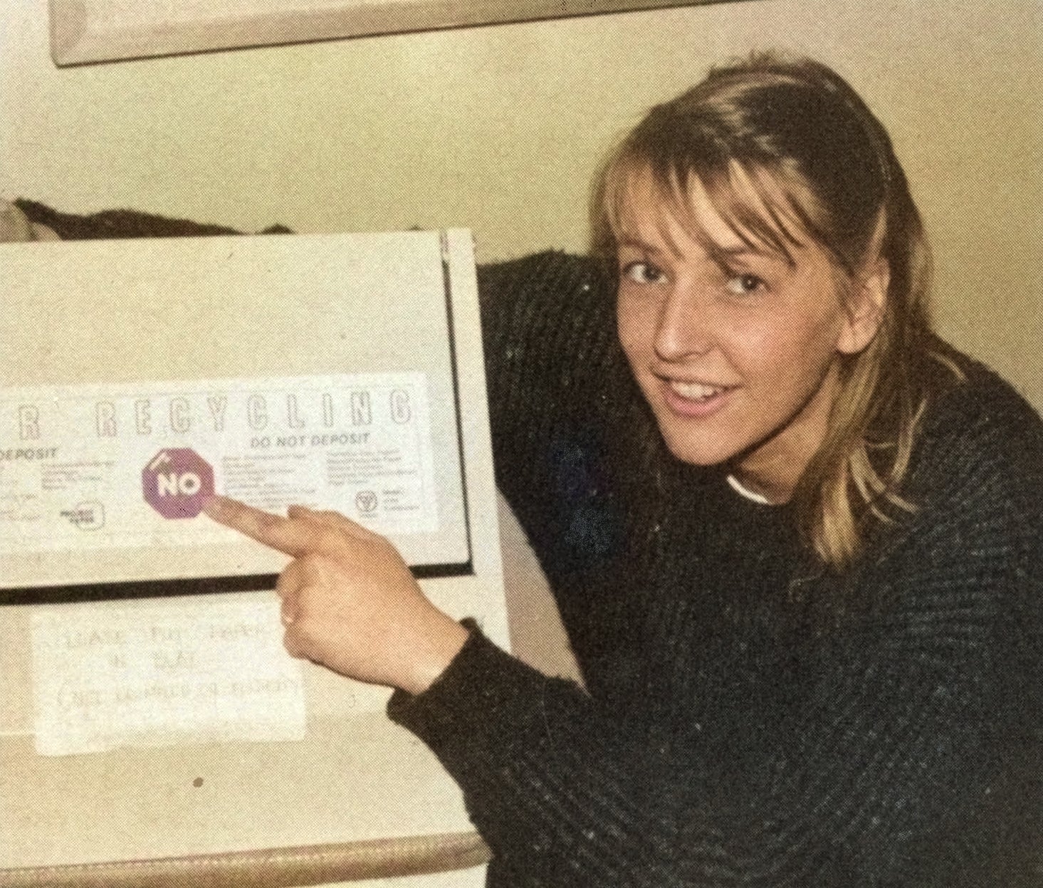 Student points out recycling guide from the 1980s