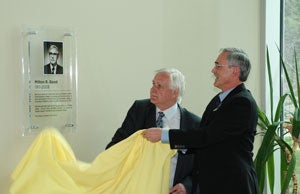 Jim Good and Henry Paetkau unveil the plaque naming the library in Milton Good's honour