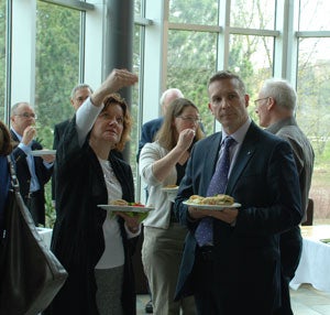 Dr. Marlene Epp explains the new entry to the archives to Member of Parliament, Peter Braid.