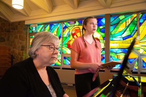 music student singing in the chapel