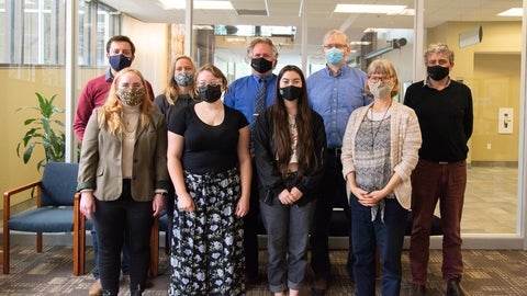 Grebel’s Green Team members gathered together with face masks 