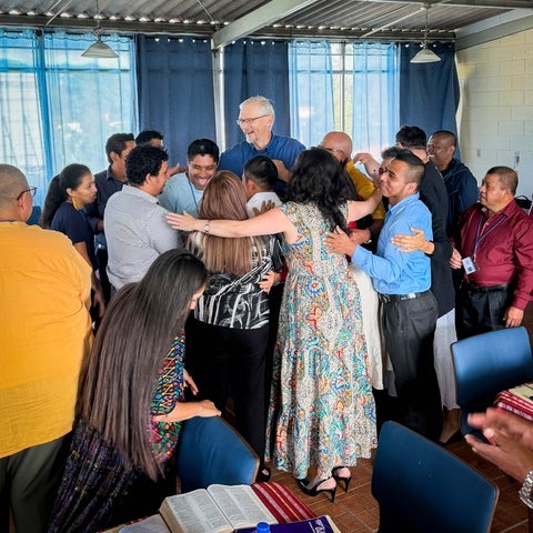 Derek Suderman surrounded by students in Guatemala