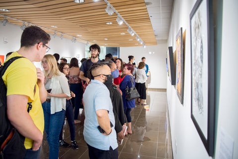 People attend a Grebel Gallery opening