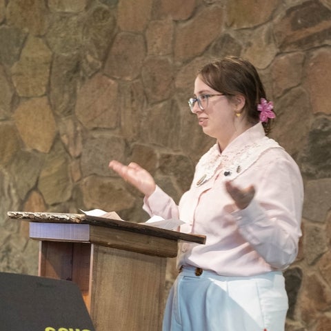 Amani Ciccarelli standing at a podium 