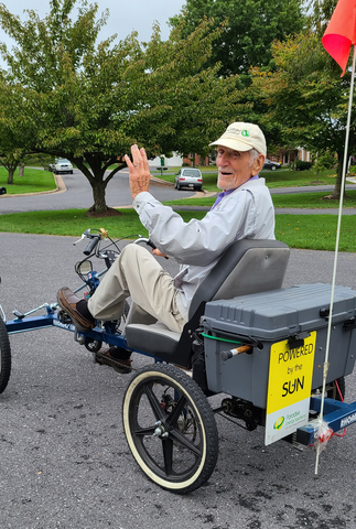 cal redekop riding a electric-solar quadricycle