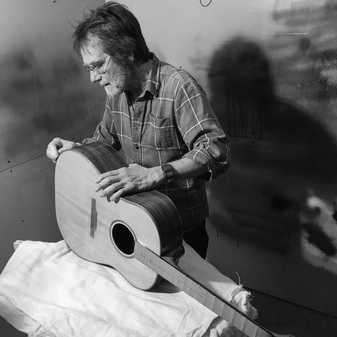 Charles posing with a guitar 