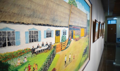a close up of a farm house painting in the Grebel Gallery