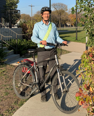 david neufeld standing with a bike