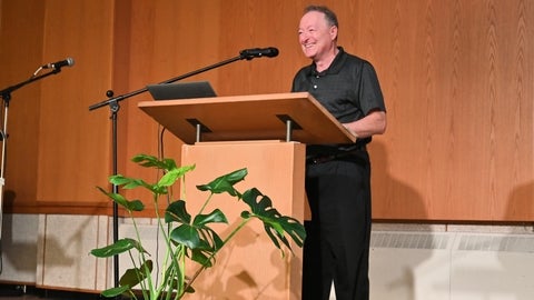 Peter Hart speaking at a podium