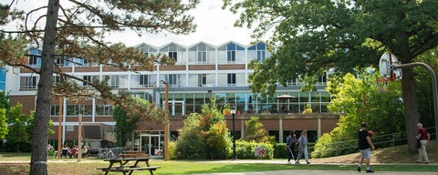 students walking on path outside of Grebel residence