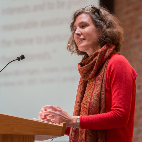 Jane Kuepfer speaking at a podium