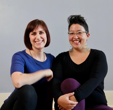 Leena and Emma sitting posing together