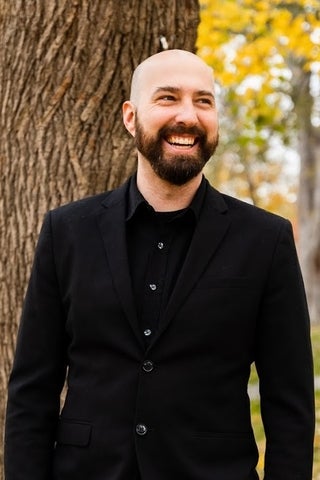 Portrait of Maxwell Kennel in fornt of a tree