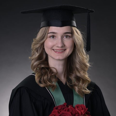 Chaira in her graduation cap and gown