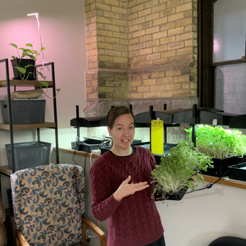 Rachel Zehr holding a plant