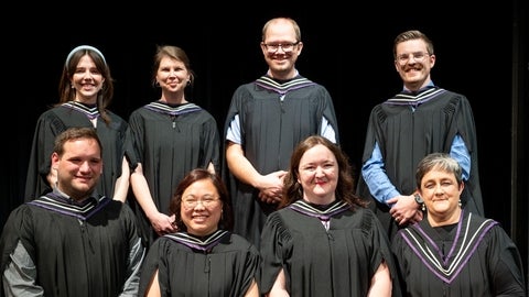 MTS grads posing together in Graduation robes