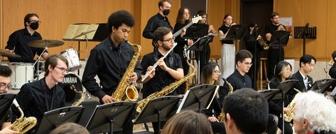 students play saxaphones, flutes, and jazz instruments during a concert